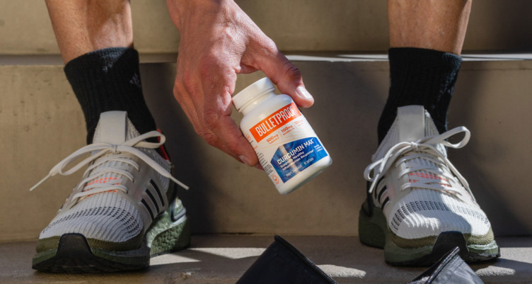 Runner holding a bottle of Bulletproof Curcumin Max