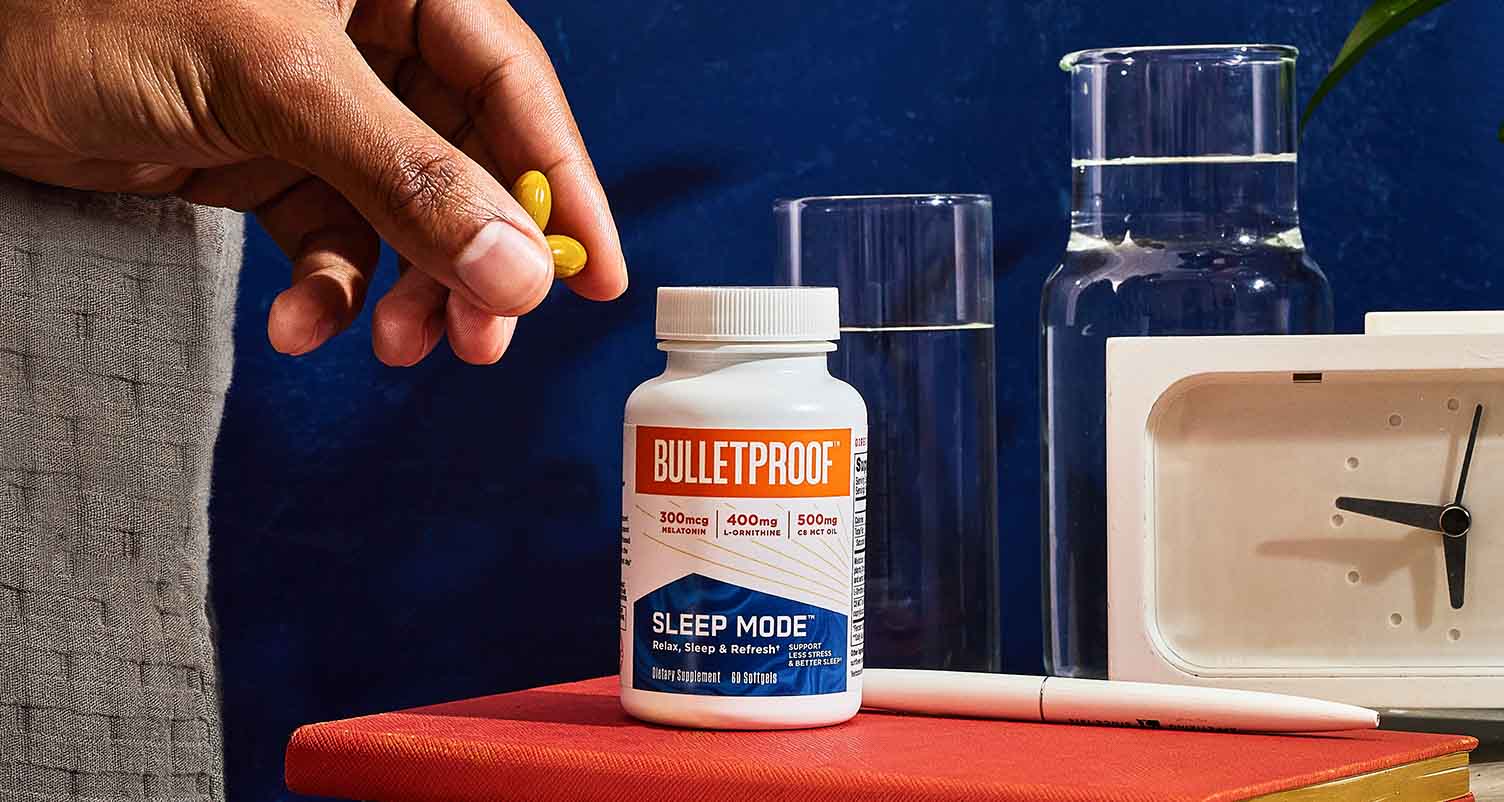 hand taking sleep supplements