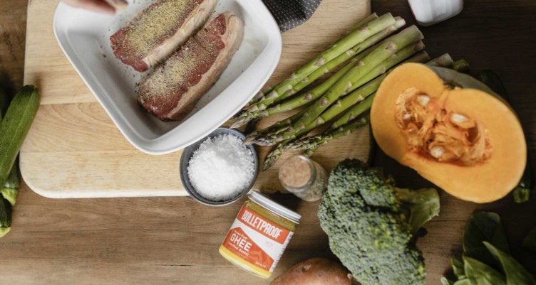 Seasoned steak and veggies alongside Bulletproof Grass-Fed Ghee