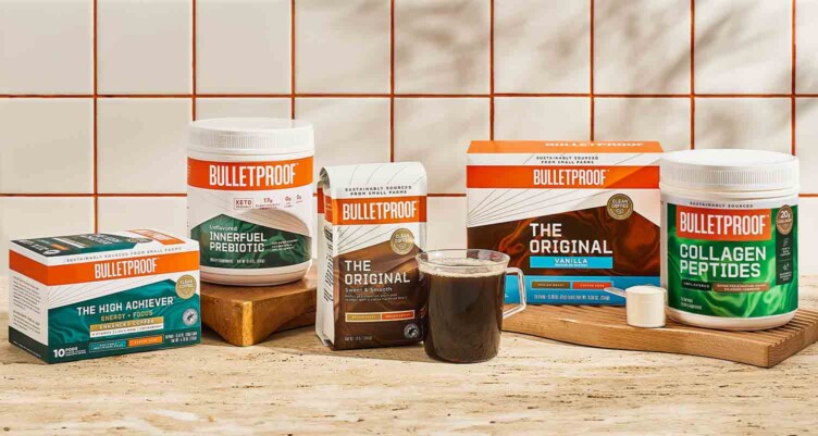 Variety of Bulletproof coffees & supplements lined up on a tabletop