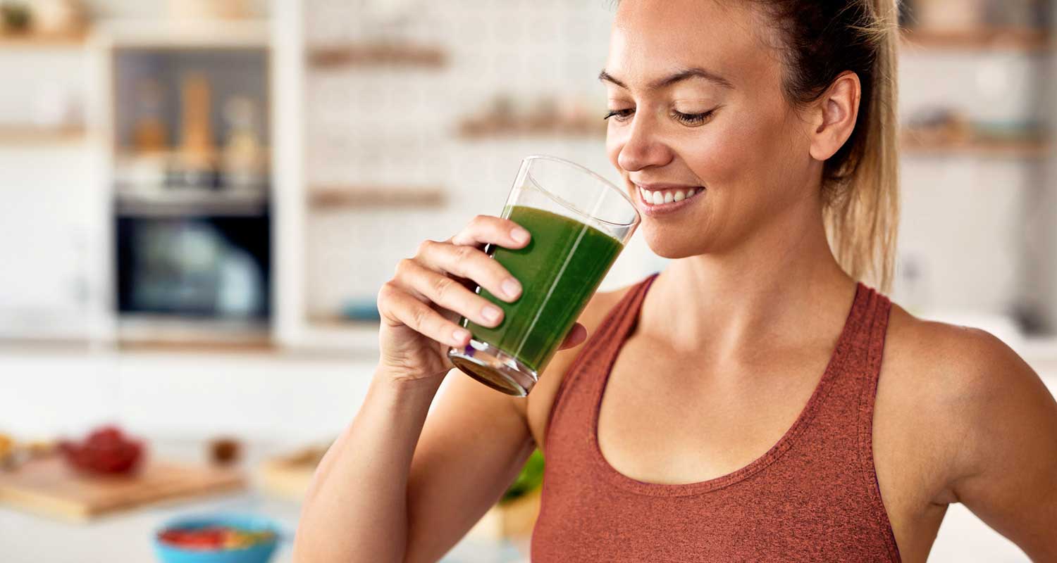 woman drinking kale smoothie