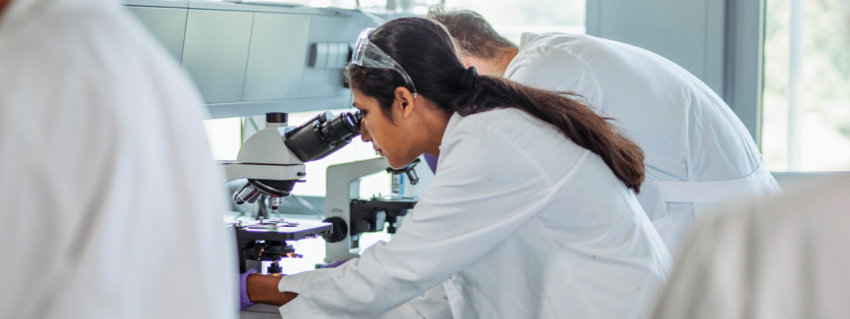 A laboratory with someone looking into a microscope testing the Bulletproof products